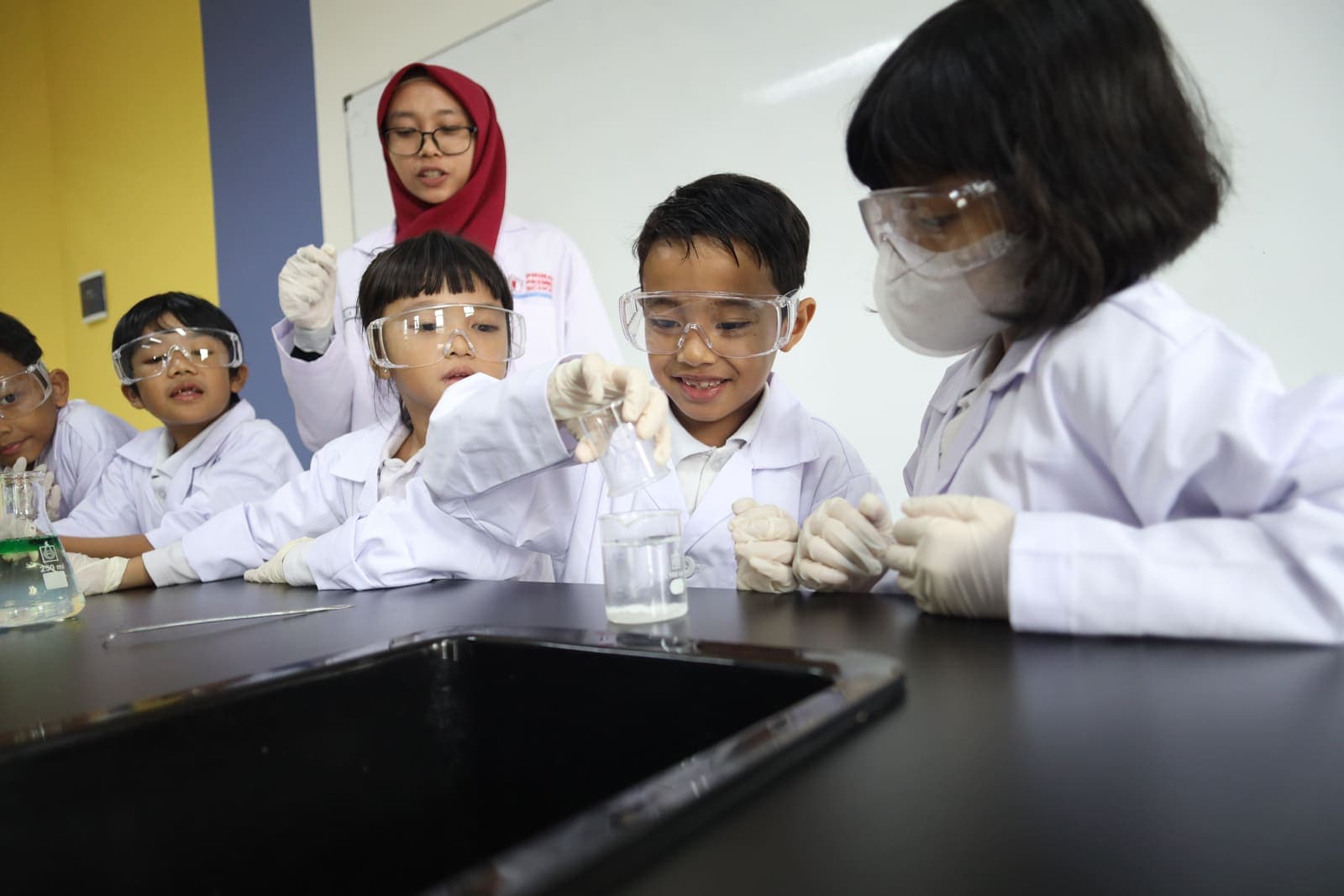 Young scientists doing a supervised experiment